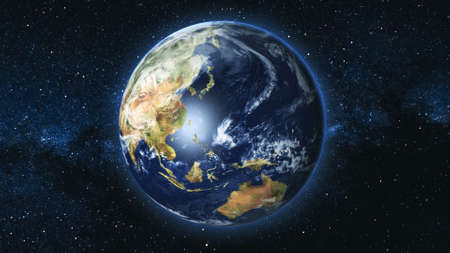 Realistic Earth Planet, rotating on its axis in space against the background of the Milky Way star sky. Astronomy and science concept. Continents and oceans.の写真素材