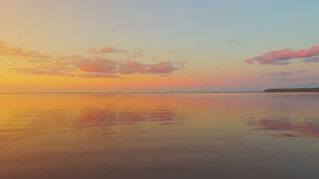 Aerial Drone Flight: Beautiful Sky and Clouds Reflected in Water. Sunset soft light. Colorful nature background. Magestic landscape. Kiev Sea, Ukraine, Europe.の写真素材