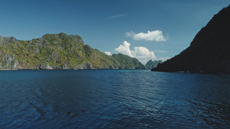 Tropical seascape at green cliff coast of Palawan Islands, El Nido, Philippines. Epic summer tourism...