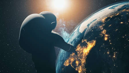 Close-up silhouette astronaut: space Earth planet at sun light in dark star sky of solar system in modern pressure suit.の写真素材