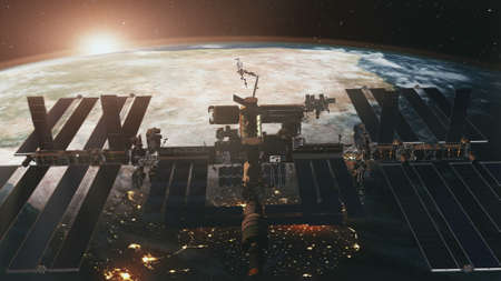 International Space Station spaceflight at Earth sunset in 3d animation.の写真素材