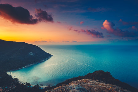 Silhouette Thailand aerial: sunset island sea bay at highland rainforest, sand beach coastline of Koh Tao Island, Asia. Epic asian ocean seascape at sun set cloudy sky. Tropic resort in cinematic shotの写真素材