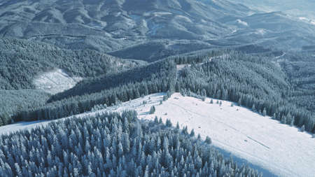 Snow ski slope resort at mountain aerial. Active sport and recreation. Nobody nature landscape. Extreme mountaineering vacation. Unbelievable holiday at Carpathian mounts, Bukovel, Ukraine, Europeの写真素材