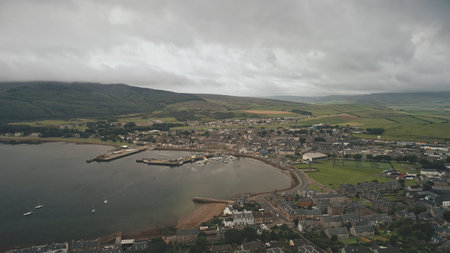 Port citycsape with modern, historic buildings at ocean bay aerial. Ships, yachts at wharf. Streets...