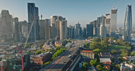 Australia, Sydney: Aerial view Sydneys urban landscape with skyscrapers, bridge road cars, highway traffic, and green spaces reflecting modern city architecture skyline in background. Droneの写真素材