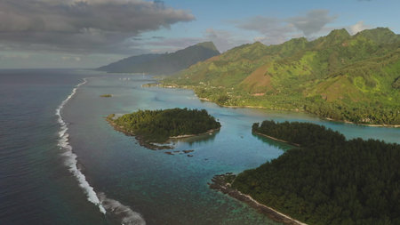 Aerial drone stunning beauty of Moorea tropical island in French Polynesia, green mountains, turquoise lagoon coral reef. Popular travel destination, remote wild paradise, exotic summer travelの写真素材