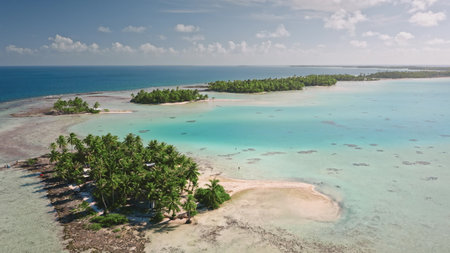 French Polynesia, Rangiroa island: Breathtaking aerial view showcasing Rangiroa. French Polynesia. Crystal clear turquoise lagoon. Lush palm trees. Wild nature travel landscape. Drone flightの写真素材