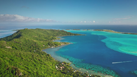 Aerial view of Bora Bora island with turquoise lagoon, coral reef, boats sailing, green tropical...
