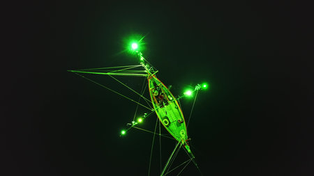 Green lights from a squid fishing boat create a mesmerizing spectacle in the dark waters near Koh...