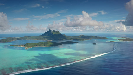 Aerial view Bora Bora island archipelago in French Polynesia. Turquoise lagoon coral reef barrier,...