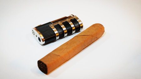 golden metal lighter and hand made cigar