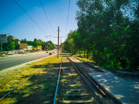 Metal tram rails in the middle of the road, Zaporozhye, Ukraine, August 23, 2018.のeditorial素材