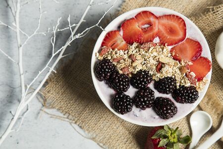 Granola served with yogurtの写真素材
