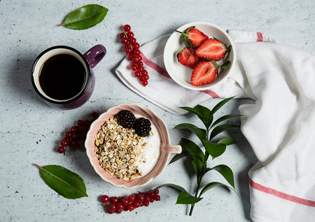 Granola served with milk and coffeeの写真素材