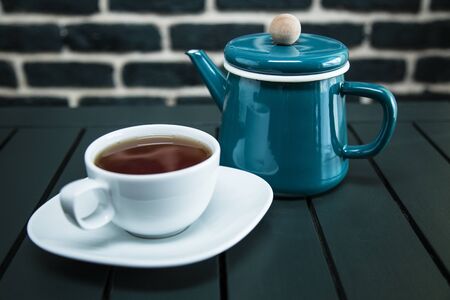 white tea cup on tableの写真素材