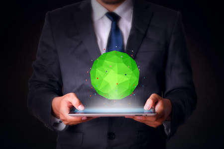 Green polygon with tablet computer business technologyの写真素材