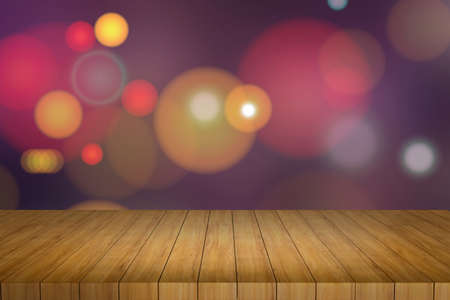 Wooden table in front of abstract blurred lights background,bokeh lightsの写真素材