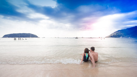 Young happy couple on the beachの写真素材