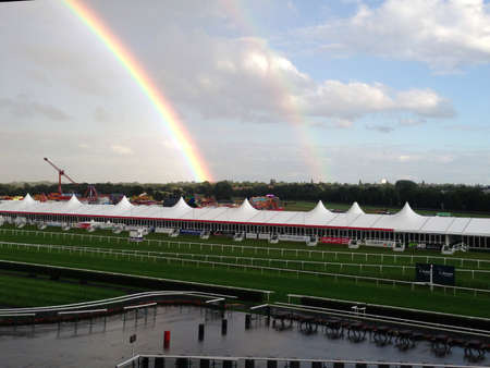 View of double rainbow at a horse-racing trackの素材