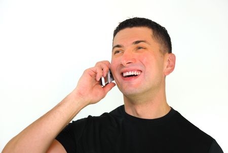 A portrait of a smiling Caucasian man talking on a mobile phone isolated over white background.の写真素材