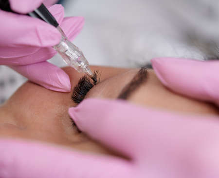 Permanent eyeliner tattoos enhancement coloring in spa professional serviceの写真素材