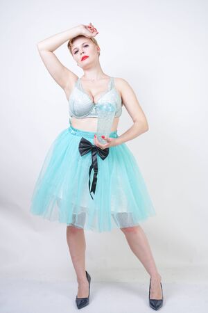 plus size woman with short hair wear bra and tutu skirtの写真素材