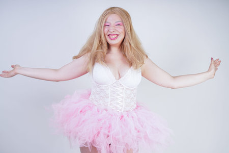 blonde asian adult plus size doll wearing pink white dress