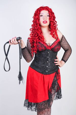 Portrait of redhead sexy woman wearing black corsetの写真素材