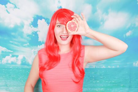 pretty bright woman with fruits, the concept of summer and healthy nutritionの写真素材