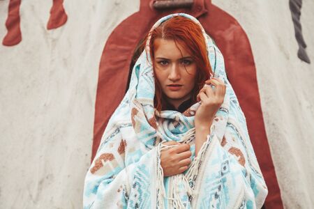 redhead modern girl near Native American TeePee Campsiteの写真素材