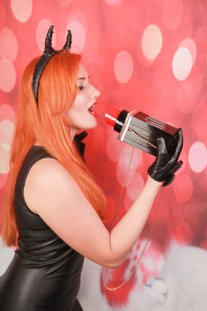 shot of gorgeous lady with amazing big lipstick bag