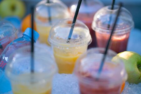 Strawberry and orange cocktails and green apples in the iceの写真素材