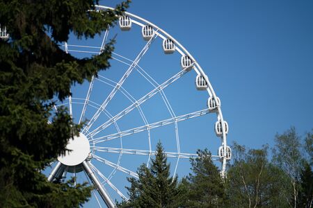 Amusement park rides with a very blue sky as backgroundの写真素材