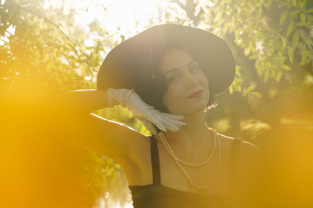 Sexy young pretty woman with vintage retro hat and seductive face outdoor