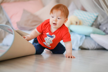 little baby crawling on the floor with carpet