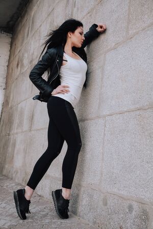 attractive fitness woman lifestyle portrait. caucasian model walking in the cityの写真素材