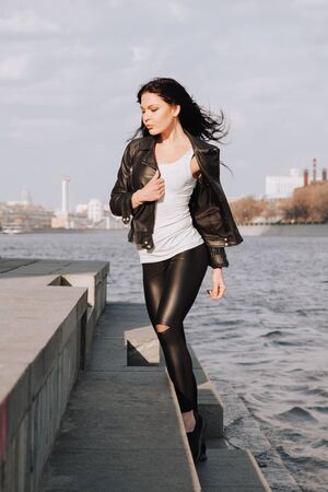 attractive fitness woman lifestyle portrait. caucasian model walking in the cityの写真素材
