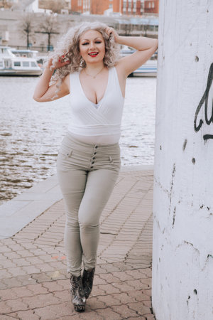 confident overweight woman walking the city street