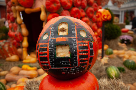 pumpkins in honor of the celebration of autumn and Halloween. festival of vegetables, creative house...