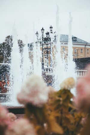 bubbling water in the stone fountain of the city, no one.の写真素材