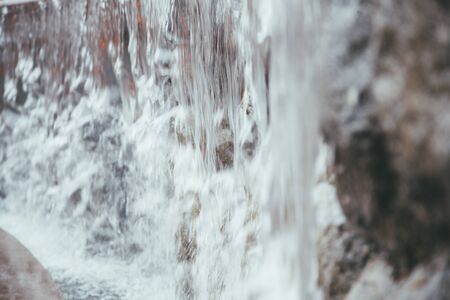 bubbling water in the stone fountain of the city, no one.の写真素材