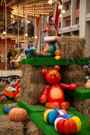 Old carousel with horses in a holiday autumn evening park with nobody.の写真素材