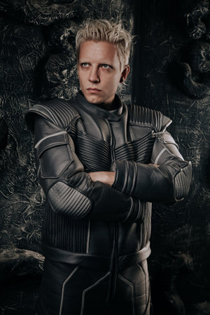 Ready for new discovery. Portrait of concentrated young cosmonaut with caucasian face wearing...