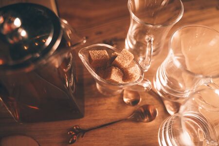 hot tea in a clear teapot and three cups on the table. nobodyの写真素材