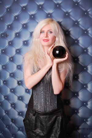 Young fortune teller working with her stone magic ballの写真素材
