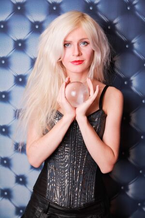 Young fortune teller working with her stone magic ballの写真素材