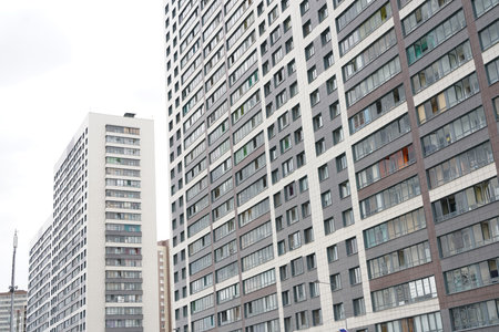 Frontal view of facade of building with a lot of windows. modern city house.