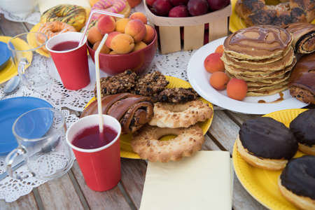 sweets on a table in the gardenの写真素材