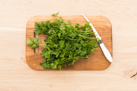 parsley on a board for cutting and cooking