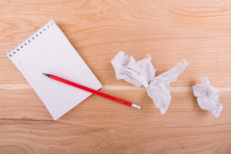 notebook and pen on the wooden backgroundの写真素材
